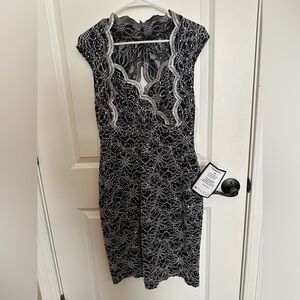Black and silver sequined Connected midi dress. Size 10.